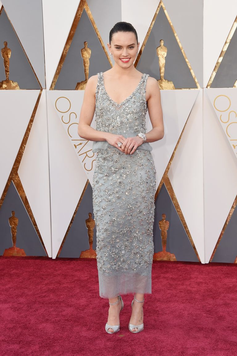 Daisy Ridley 
Dress by Chanel Haute Couture; shoes by Christian Louboutin; clutch by Chanel; jewels by Chanel Fine Jewelry.