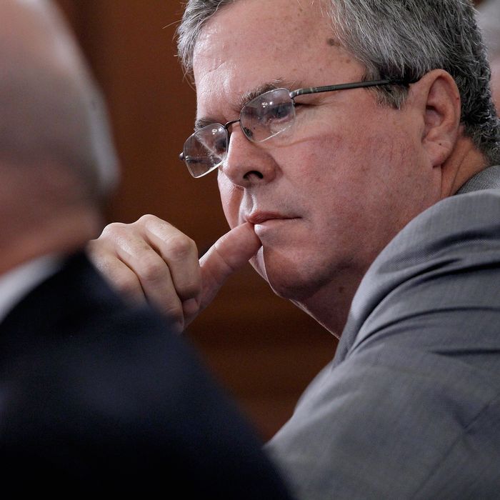 WASHINGTON, DC - JUNE 01: Former Florida Governor Jeb Bush (C) listens to opening statements while testifying before the House Budget Committee in the Cannon House Office Building on Capitol Hill June 1, 2012 in Washington, DC. The committee members engaged in a wide-ranging debate about tax and spending policy during the hearing titiled, 