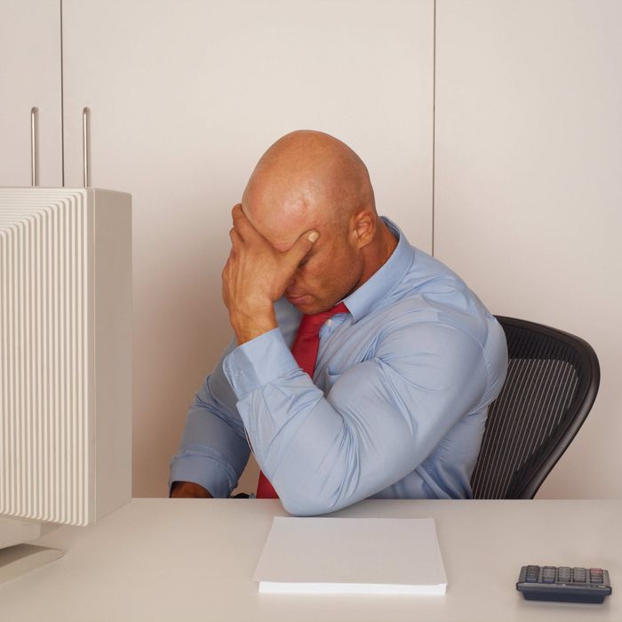 Dejected Man Sitting at Desk