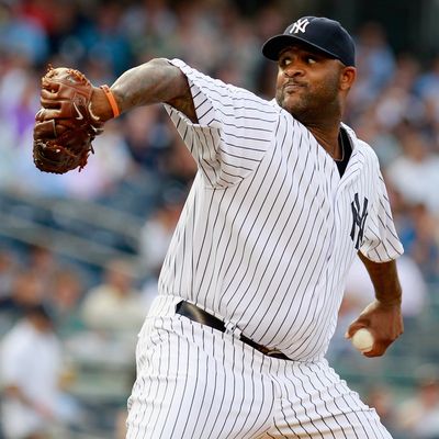 CC Sabathia #52 of the New York Yankees pitches in the first-inning against the Toronto Blue Jays at Yankee Stadium on July 17, 2012