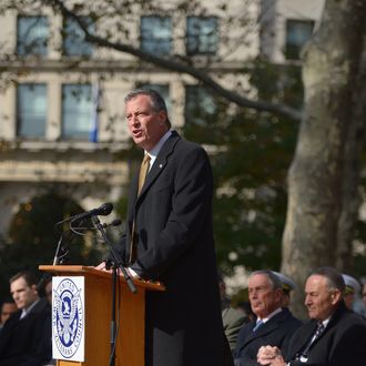 NYC Public Advocate/Mayor-elect Bill de Blasio addresses the audience during the 94th annual New York City Veterans Day Parade on 5th Avenue on November 11, 2013 in New York City. The parade is the largest of its kind in the country and this year is especially dedicated to women serving in the armed forces. 