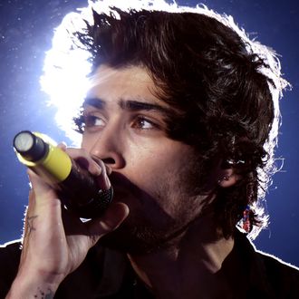 PASADENA, CA - SEPTEMBER 11: (EDITORIAL USE ONLY; NO COVERS; NO USE IN ANY MAGAZINE OR OTHER PUBLICATION BASED PREDOMINANTLY ON ONE DIRECTION OR ANY ONE OR MORE MEMBERS OF ONE DIRECTION) Singer Zayn Malik of One Direction performs onstage during the One Direction