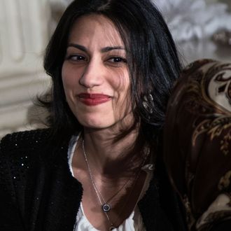 Huma Abedin (R), aide to US Secretary of State Hillary Clinton, and others listen while US President Barack Obama speaks in the State Dining Room of the White House on August 10, 2012 in Washington during Iftar, the fast-breaking meal of the Muslim holy month of Ramadan. 