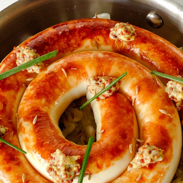 Fruitwood-smoked kielbasa with beer mustard served on top of sauerkraut.