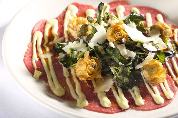 Beef carpaccio with crisp artichokes, red watercress, Meyer lemon.