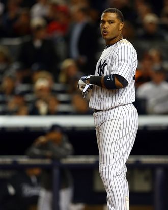 Robinson Cano #24 of the New York Yankees looks on after striking out during Game Three of the American League Division Series against the Baltimore Orioles at Yankee Stadium on October 10, 2012 in the Bronx borough of New York City.
