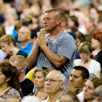 HOUSTON, TX - AUGUST 6: Gary Don Holley stands and prays amidst the crowd of participants during the non-denominational prayer and fasting event, entitled 