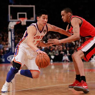 NEW YORK, NY - MARCH 14: (L) Jeremy Lin #17 of the New York Knicks drives against (R) Chris Johnson #17 of the Portland Trail Blazers at Madison Square Garden on March 14, 2012 in New York City. NOTE TO USER: User expressly acknowledges and agrees that, by downloading and/or using this Photograph, user is consenting to the terms and conditions of the Getty Images License Agreement. (Photo by Chris Trotman/Getty Images)