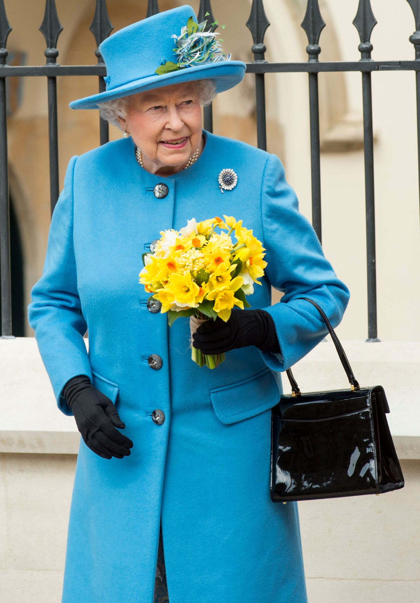 Why does the Queen carry a purse everywhere? What does she keep in it that  isn't provided by her team and security? - Quora