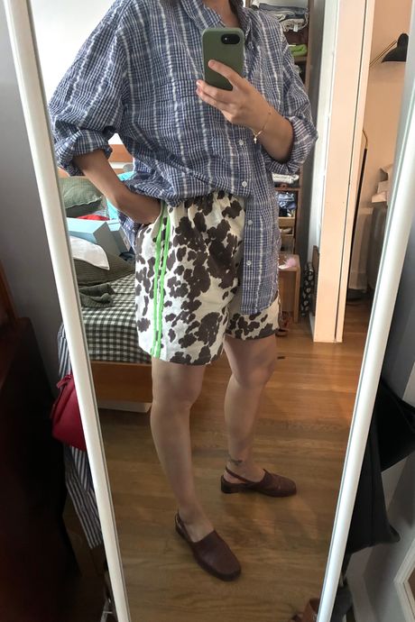 View of Strategist senior writer Liza Corsillo wearing her Little Lawless cow print shorts.