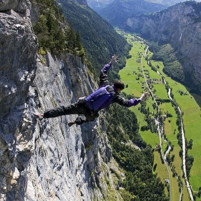 Dean Potter executes a free solo climb and fall with parchute in summer 2008 at Lauterbrunnen in Switzerland. 