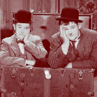1932: Stan Laurel (1890 - 1965) and Oliver Hardy (1892 - 1957) in a scene from 'Pack Up Your Troubles', directed by George Marshall and Ray McCarey. (Photo via John Kobal Foundation/Getty Images)
