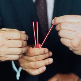 Three businessmen picking straws, focus on hands, close-up