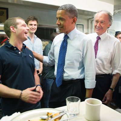 US President Barack Obama (C) talks with Benjamin Gay (L) during a surprise visit to Charlie's Sandwich Shoppe in Boston, MA, June 12, 2013, with US Congressman Ed Markey (R). 