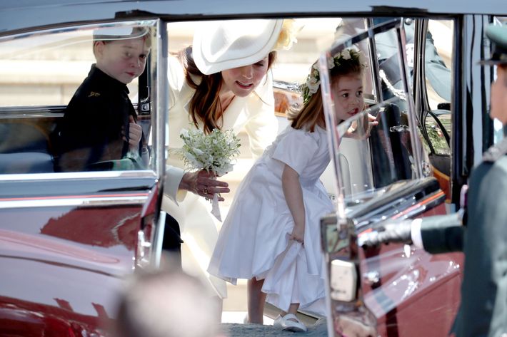 Prince George, Kate Middleton, and Princess Charlotte arriving at the royal wedding.