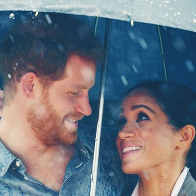 Meghan Markle and Prince Harry under an umbrella in Australia.