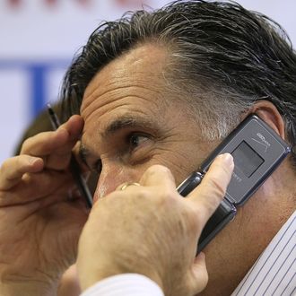 MANCHESTER, NH - JANUARY 09: Republican presidential candidate, former Massachusetts Gov. Mitt Romney makes calls to likely voters at his New Hampshire campaign headquarters on January 9, 2012 in Manchester, New Hampshire. With one day to go before the New Hampshire primary, Mitt Romney is making one final campaign push through the state. (Photo by Justin Sullivan/Getty Images)