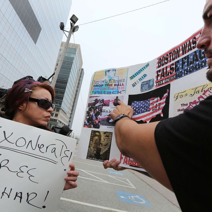 Karina Figueroa, left, of NYC, and Duke LaTouf of Las Vegas, believe in Tsarnaev's innocence. Media and supporters of alleged Boston Marathon bombing suspect Dzhokhar Tsarnaev gather outside the John Joseph Moakley United States Courthouse on July 10, 2013, before the 19-year-old is charged. 