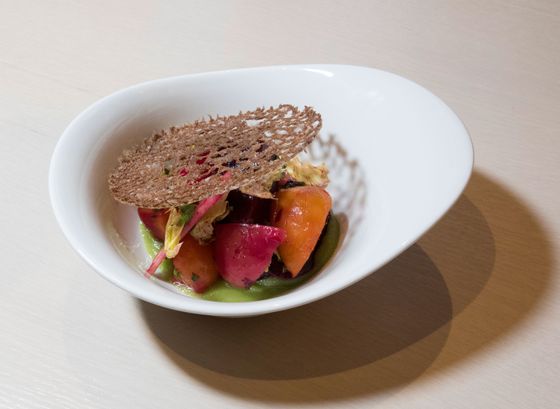 Baby beets and apples with lovage, celery leaf, and a teff crisp.