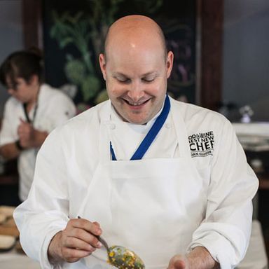 2012 Best New Chef Dan Kluger plates his dish of sautéed corn, manchego, jalapeño, and lime.