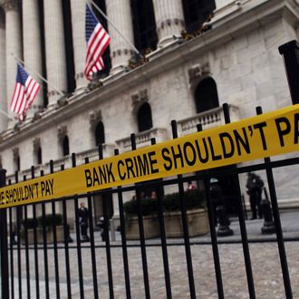 NEW YORK, NY - DECEMBER 15: Yellow tape hangs on a fence during a protest by activists, including the unemployed and those living in foreclosed homes, outside of the New York Stock exchange against Wall Street bonuses on December 15, 2010 in New York City. Financial institutions may be giving the second largest payout in bonuses in the history of Wall Street. Last year Wall Street paid out a reported $20.3 billion in bonuses. (Photo by Spencer Platt/Getty Images)