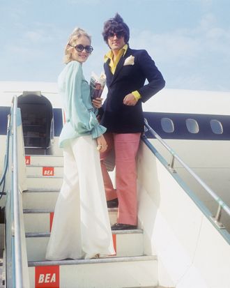 Jet-setters getting aboard a plane — the Strategist reviews the best travel pants for women.