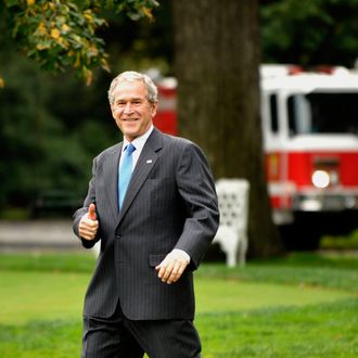 U.S. President George W. Bush gives the thumbs up sign as he departs the White House in Washington, D.C., U.S., on Friday, Oct. 17, 2008. Bush is spending the weekend at Camp David, Maryland, where he is scheduled to meet tomorrow with French President Nicolas Sarkozy and European Commission President Jose Barroso. 