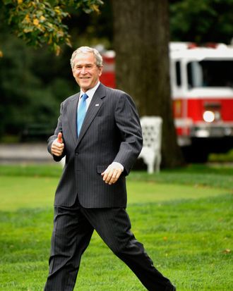U.S. President George W. Bush gives the thumbs up sign as he departs the White House in Washington, D.C., U.S., on Friday, Oct. 17, 2008. Bush is spending the weekend at Camp David, Maryland, where he is scheduled to meet tomorrow with French President Nicolas Sarkozy and European Commission President Jose Barroso. 