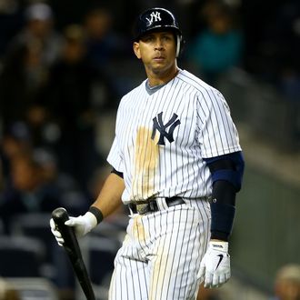 Alex Rodriguez #13 of the New York Yankees walks back to the dugout as he reacts to striking out in the bottom of the sixth inning against the Detroit Tigers during Game One of the American League Championship Series at Yankee Stadium on October 13, 2012 in the Bronx borough of New York City, New York.