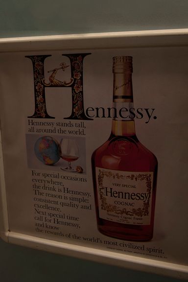 Interiors were tricked out as well, featuring such details as this old Hennessy ad.