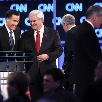 Mitt Romney and Newt Gingrich during a break in the debate at the North Charleston Coliseum January 19, 2012 in Charleston, South Carolina. 