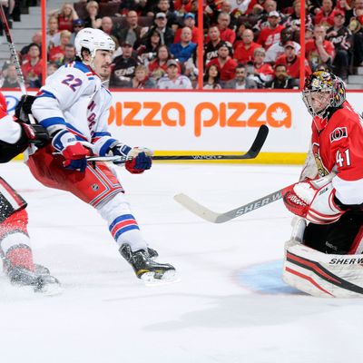 Craig Anderson #41 of the Ottawa Senators stops the puck on a break away attempt by Brian Boyle #22 of the New York Rangers in Game Three of the Eastern Conference Quarterfinals .