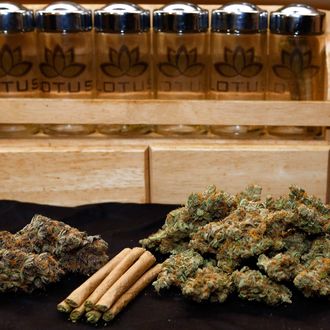 A 1/4 ounce, left, and one ounce of marijuana are pictured along with a handful of joints at a dispensary in Denver on Wednesday, April 24, 2013.