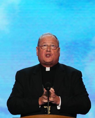 Roman Catholic Cardinal and Archbishop of New York His Eminence Timothy Dolan gives the benediction during the final day of the Democratic National Convention at Time Warner Cable Arena on September 6, 2012 in Charlotte, North Carolina. The DNC, which concludes today, nominated U.S. President Barack Obama as the Democratic presidential candidate.