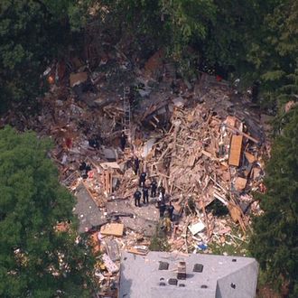 This image taken from video provided by News 12 Long Island shows the wreckage of a house that was destroyed by an apparent gas-related explosion, killing a toddler and sending 14 other people to hospitals, in the Long Island town of Brentwood, N.Y., Tuesday, Aug. 14, 2012. The entire structure of the house, situated on a block of well-kept, modest homes, was reduced to small shards of wood, plywood, drywall, insulation and other building material. 