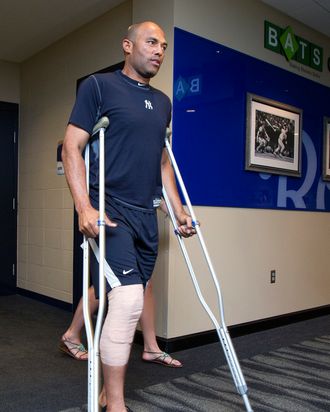 New York Yankees relief pitcher Mariano Rivera emerges from the team's clubhouse before talking with members of the media