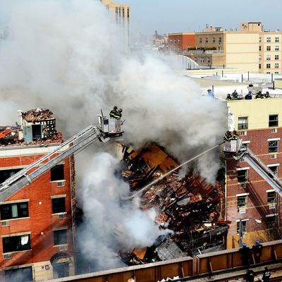 In this image handout provided by the Office of Mayor of New York, firefighters from the Fire Department of New York (FDNY) respond to a five-alarm fire and building collapse at 1646 Park Ave in the Harlem neighborhood of Manhattan March 12, 2014 in New York City. Reports of an explosion were heard before the collapse of two multiple-dwelling buildings at East 116th St. and Park Avenue that left at least 17 injured and a number of people are missing.