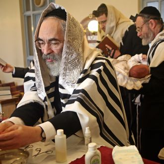 The Mohel washes his hands before the circumcision ceremony begins. On the 8th day after birth a Brit Milah (Circumcision) is performed on a Jewish baby boy (unless there is a medical reason to delay it). The ceremony takes place in the synagogue and the man who carries out the skin removal is know as a Mohel and is medically trained, the boy is also given his Hebrew and/or English names.