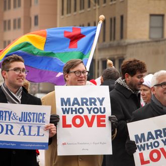 NORFOLK, VA - FEBRUARY 4: Spencer Geiger, Carl Johansen and Robert Robert Roman protest for equal marriage outside the Walter E. Hoffman U.S. Courthouse as oral arguments in the case of Bostic v Rainey proceed on February 4, 2014 in Norfolk, Virginia, Virginia Attorney General Mark Herring has concluded that Virginia's ban on gay marriage is unconstitutional and he will no longer defend it in federal lawsuits. (Photo by Jay Paul/Getty Images)