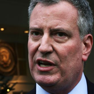 New York Mayor-elect Bill de Blasio speaks to members of the media after a meeting between U.S. President Barack Obama and a group of newly-elected mayors from across the country at the Roosevelt Room of the White House December 13, 2013 in Washington, DC. Obama met with the newly-elected mayors to discuss 