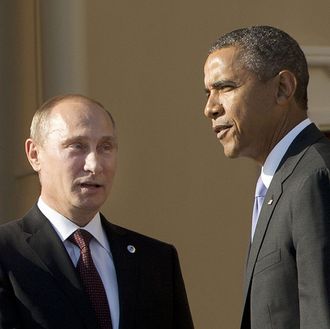 Russias President Vladimir Putin (L) welcomes US President Barack Obama at the start of the G20 summit on September 5, 2013 in Saint Petersburg. Russia hosts the G20 summit hoping to push forward an agenda to stimulate growth but with world leaders distracted by divisions on the prospect of US-led military action in Syria. AFP PHOTO/POOL/Pablo Martinez Monsivais (Photo credit should read PABLO MARTINEZ MONSIVAIS/AFP/Getty Images)