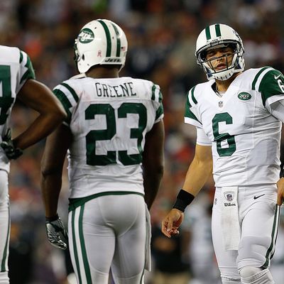 Mark Sanchez #6 of the New York Jets reacts in the huddle in the fourth quarter during a game with New England Patriots at Gillette Stadium on October 21, 2012 in Foxboro, Massachusetts. 