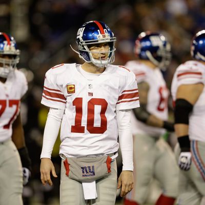  Quarterback Eli Manning #10 of the New York Giants walks off the field during the fourth quarter of the Giants 33-14 loss to the Baltimore Ravens at M&T Bank Stadium on December 23, 2012 in Baltimore, Maryland.