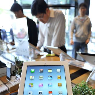 Apple's new iPad is displayed at a branch of KT, a Korean distributor of iPhones and iPads, in Seoul on April 20, 2012. The new iPad went on sale in tech-savvy South Korea, about one month after it made its international debut. AFP PHOTO / JUNG YEON-JE (Photo credit should read JUNG YEON-JE/AFP/Getty Images)