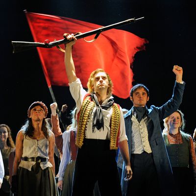 Stage actor Jon Robyns (C), as Enjolras, performs 'Do You Hear The People Sing' during a photo rehearsal for Les Miserables at the Barbican Center in London, Britain, 22 September 2010. A new production of Les Miserables, which is celebrating 25 years of the hit stage play, runs until 02 October.