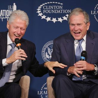 Former U.S. presidents Bill Clinton (L) and George W. Bush share a laugh during an event launching the Presidential Leadership Scholars program at the Newseum September 8, 2014 in Washington, DC. With the cooperation of the Clinton, Bush, Lyndon B. Johnson and George H. W. Bush presidential libraries and foundations, the new scholarship program will provide 'motivated leaders across all sectors an opportunity to study presidential leadership and decision making and learn from key administration officials, practitioners and leading academics.' (Photo by Chip Somodevilla/Getty Images)