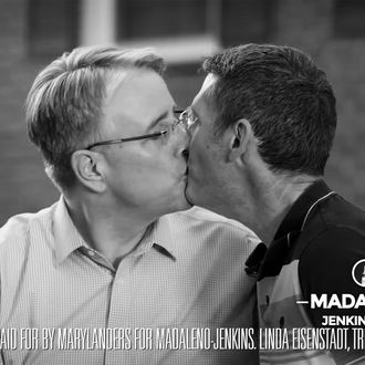 Richard Madaleno and his husband kissing.