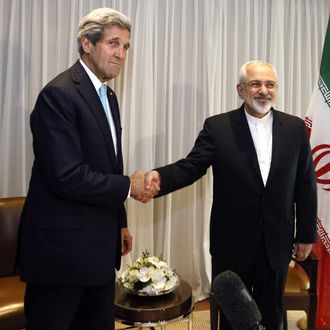 Iranian Foreign Minister Mohammad Javad Zarif shakes hands on January 14, 2015 with US State Secretary John Kerry in Geneva. Zarif said on January 14 that his meeting with his US counterpart was vital for progress on talks on Tehran's contested nuclear drive. Under an interim deal agreed in November 2013, Iran's stock of fissile material has been diluted from 20 percent enriched uranium to five percent, in exchange for limited sanctions relief. 