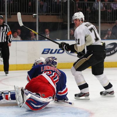 Evgeni Malkin #71 of the Pittsburgh Penguins reacts after scoring a goal against Henrik Lundqvist #30 of the New York Rangers during their game on January 19, 2012 at Madison Square Garden in New York City.