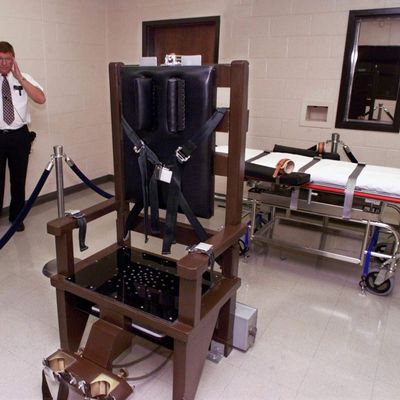 Ricky Bell, the warden at Riverbend Maximum Security Institution in Nashville, Tenn., gives a tour of the prison's execution chamber on Wednesday, Oct. 13, 1999. Both the electric chair and the lethal injection gurney are kept in the room until the time is near for a prisoner to be executed and the one not used is taken out. Robert Glen Coe, the prisoner most likely to be the first executed in Tennessee since 1960, has chosen lethal injection over the electric chair. (AP Photo/Mark Humphrey)